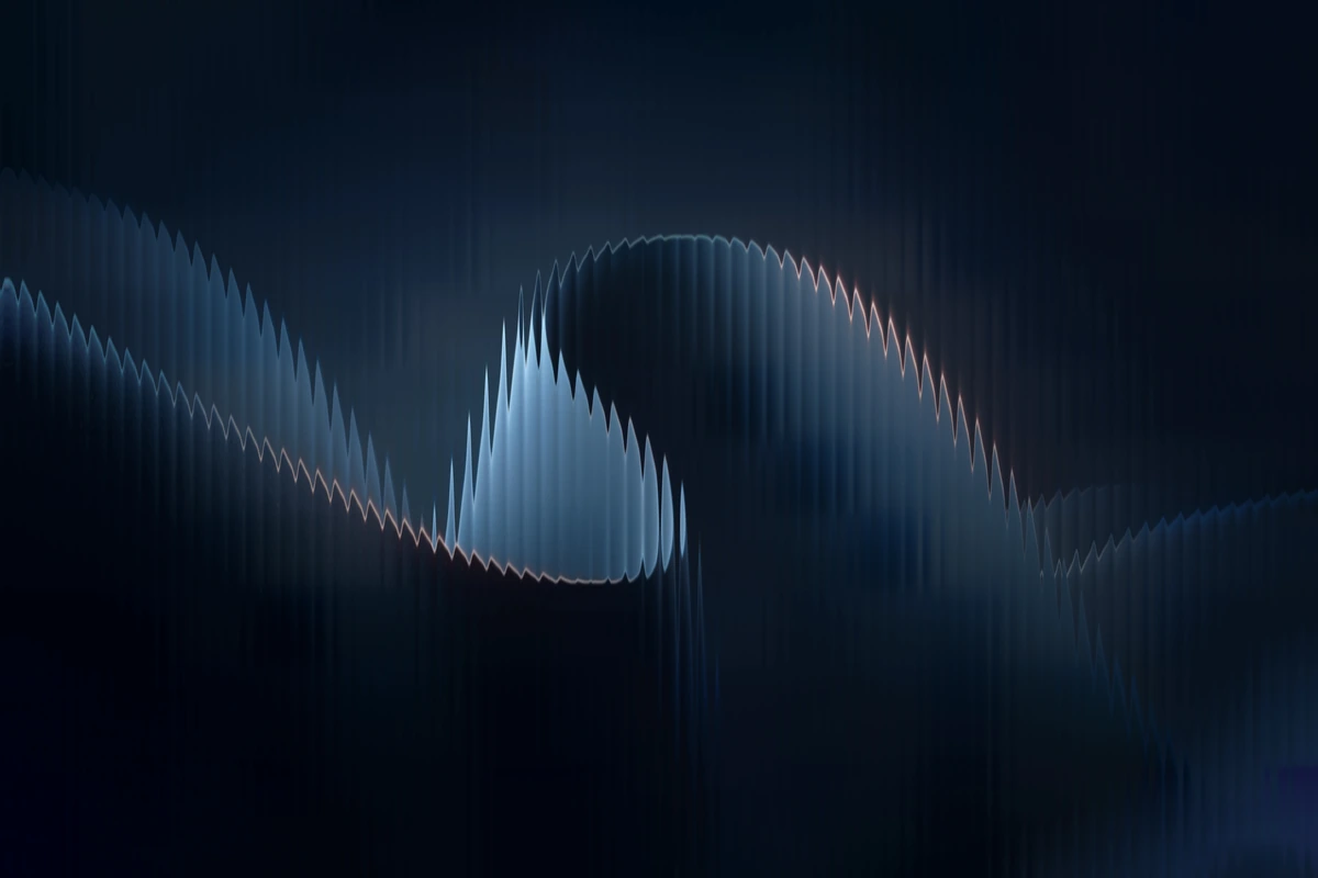 Layered blue ribbon waves with warm highlights against a dark background